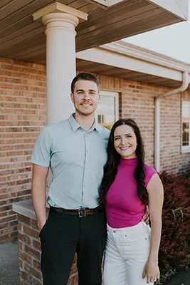 Chiropractors Cory Madison And Kallie Madison In Front Of Building