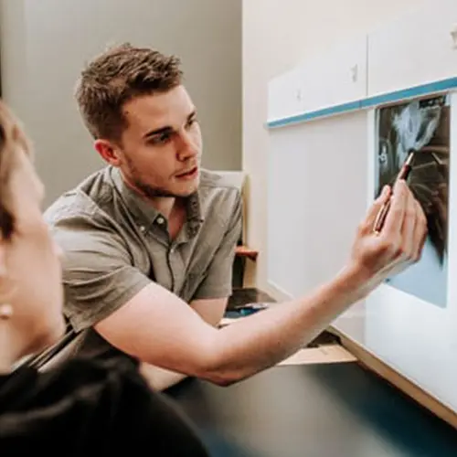 Chiropractor Cory Madison Consulting With Patient
