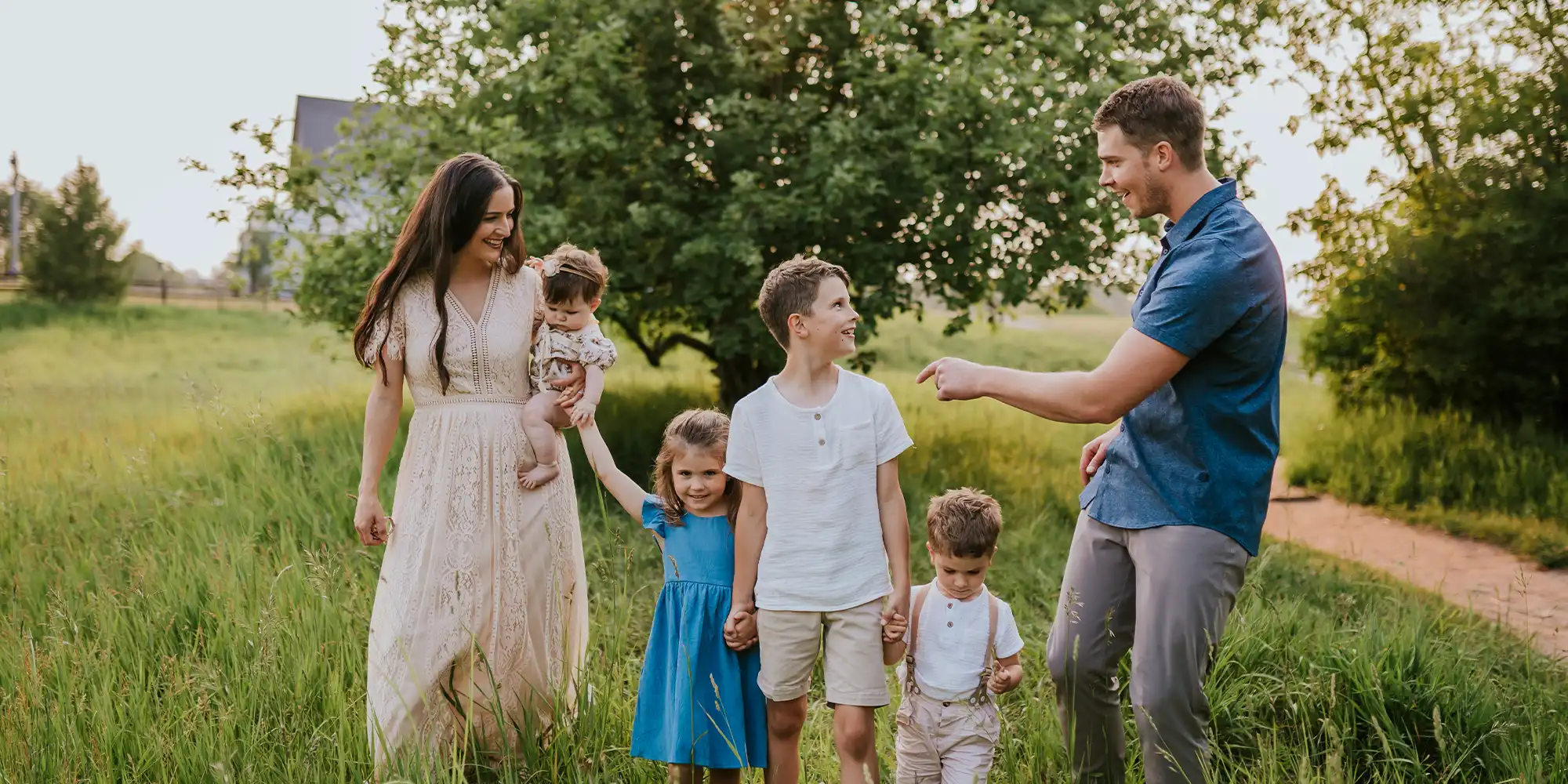 Chiropractors Kallie Madison And Cory Madison Walking With Their Family In Nature