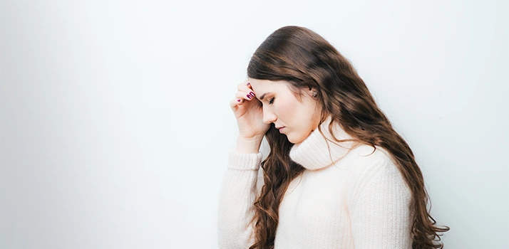 Dizzy Woman Holding Her Head