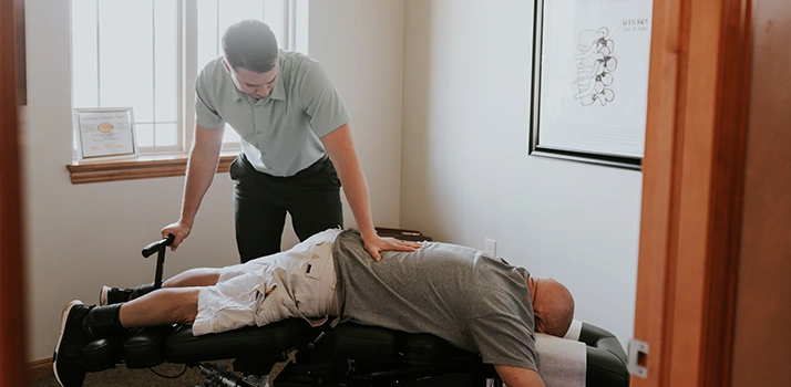 Cory Madison Adjusting A Patient On Drop Table