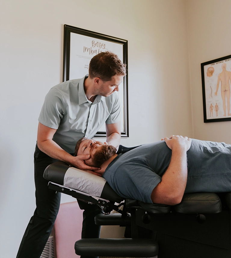 Cory Madison Adjusting Patients Neck